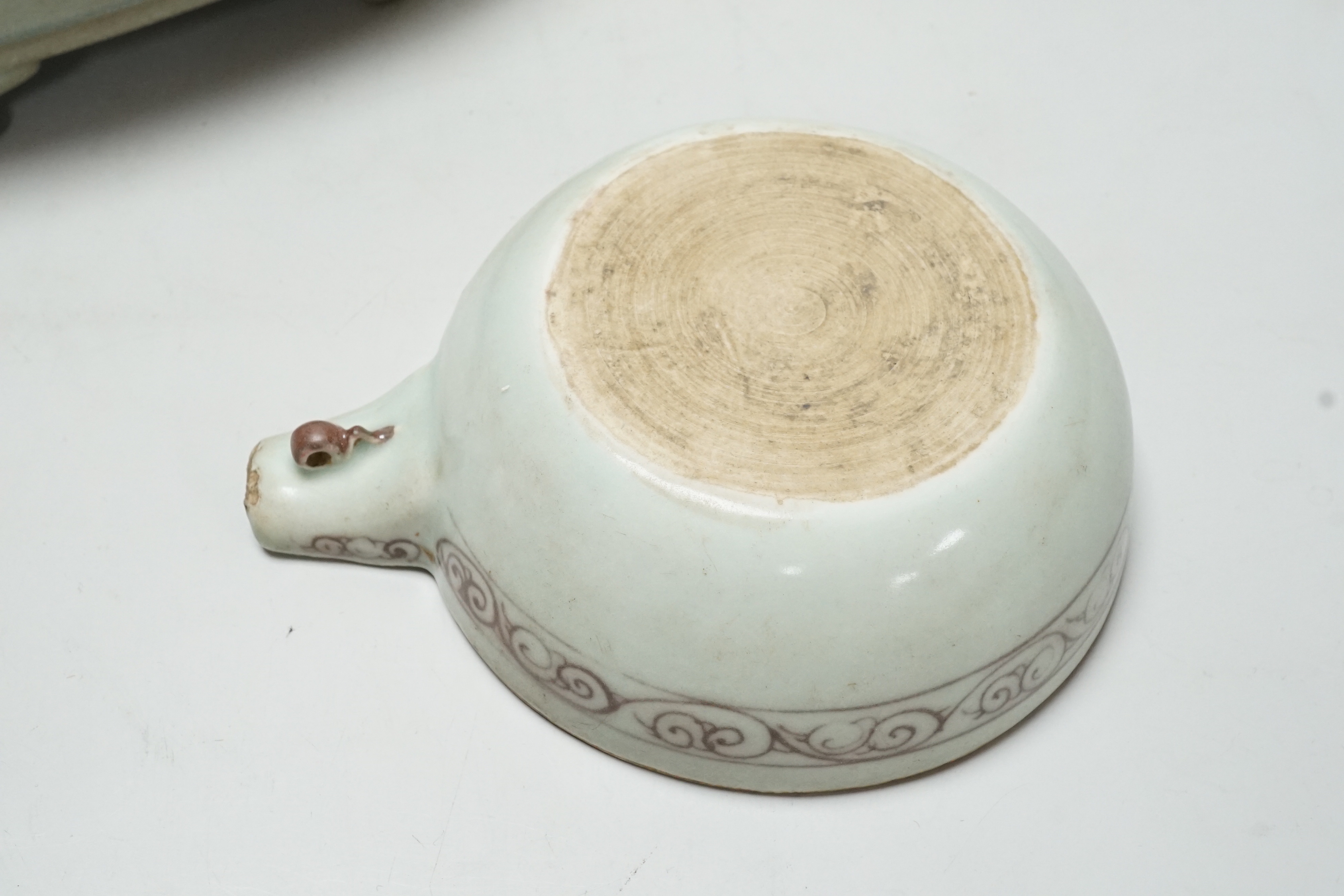 A Chinese celadon glazed dish and another, largest 24cm